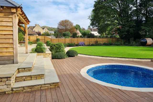 large contemporary garden in south cotswolds pool and outdoor kitchen